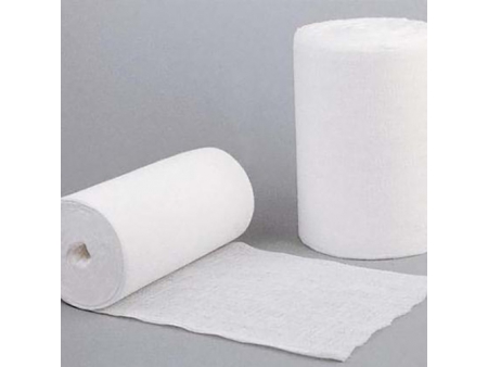 Máquina plegadora y enrolladora de gasa absorbente